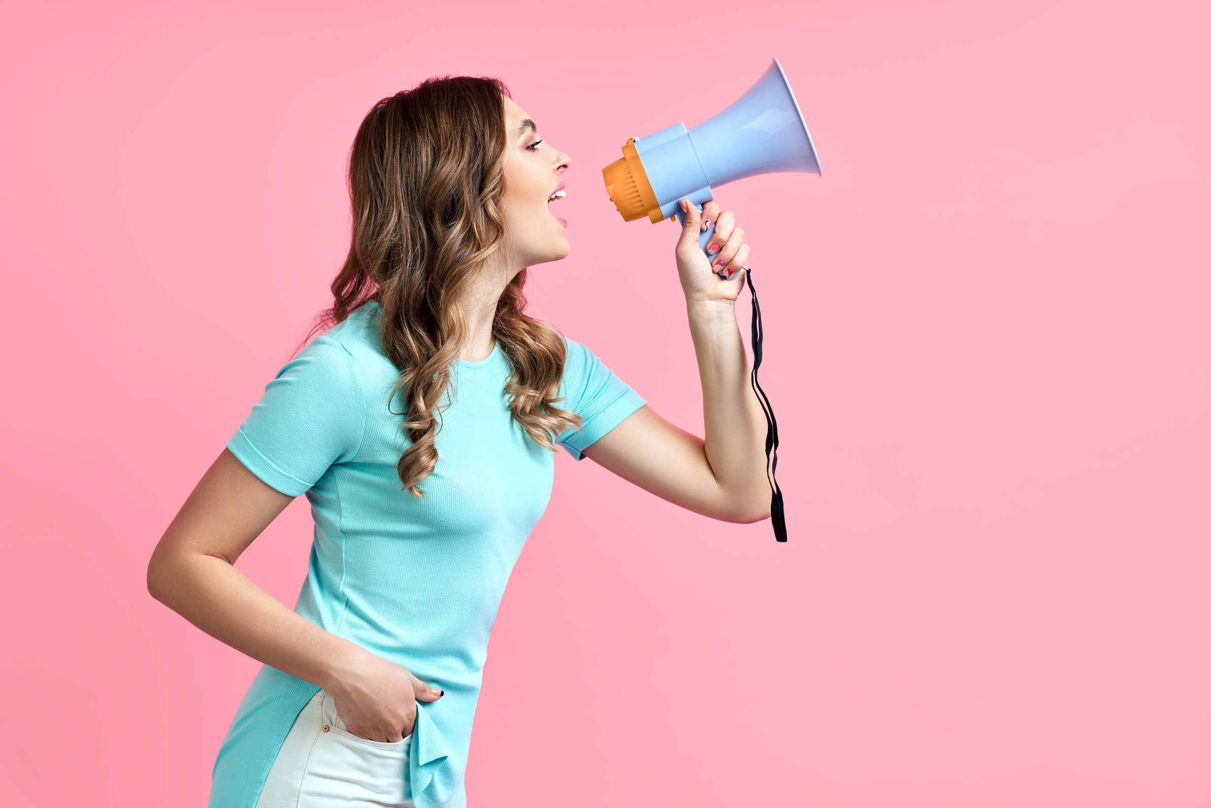 Woman with Megaphone on Pink Background